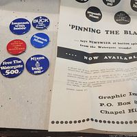 Five US political pin back buttons from the 1970s with anti-Nixon and Watergate scandal messages arranged near a flyer describing the set.