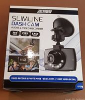 Front packaging showing product name, features (360° swivel, fits all cars, easy install), and 1080p video detail.