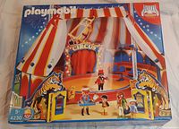Front of Playmobil Circus Tent Set 4230 box showing assembled tent with striped red and white fabric, circus ring, and tiger entrance illustrations.