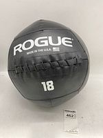 Front view of Rogue black medicine ball, displaying 'ROGUE', 'Made in the U.S.A.', and '18' weight marking.