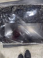 Photo of the quilt in original packaging showing Donna Karan branding.