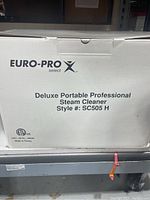 Box front showing brand Euro-Pro Select, model Deluxe Portable Professional Steam Cleaner, Style SC505H
