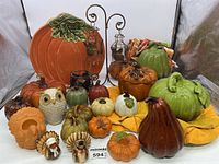 Full set of ceramic fall decor including pumpkins, owls, turkey shakers, pumpkin plate, lanterns, table cloth, and napkins.