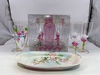 Full lot with flamingo acrylic martini set and signed floral dish visible
