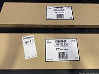 Boxes of Rain-X Latitude 22 inch wiper blades, each box labeled with item number 810165 and barcode, showing pack size of 2 blades per pack.