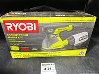 Front of box showing Ryobi branding and product image of 1/4 sheet finish sander kit.