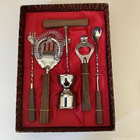 Full set of 6 bar tools in original box with red fabric lining and brown exterior showing condition and layout.