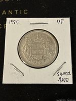 Close-up of reverse side showing crowned Canadian coat of arms and denomination 50 cents