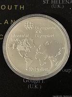 Obverse side showing Montreal 1976 Olympics world map design, Olympic symbols, and 10 Dollar denomination.