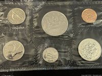 Front side of the six 1987 Canadian proof-like coins in plastic holder. Six coins include various denominations from 1 cent to 1 dollar. Coins show symbols such as Bluenose schooner and loon.