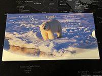 Closed display folder showing polar bear on ice, branded as 1996 Canadian $2 coin and banknote set