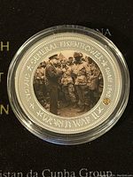 Silver plated proof medallion with image of General Eisenhower and soldiers, side one