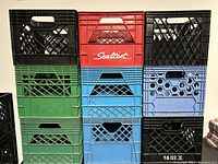 Front view of stacked crates showing colors and logos