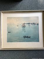 Full view of the framed sailing print depicting boats on calm water with pastel colors, showing the entire artwork and frame.