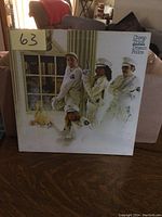 Front cover of Cheap Trick Dream Police vintage vinyl LP showing band members dressed as policemen posing by a window, album title visible.