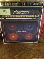 Front cover of the Headpins Turn It Loud album showing amplifier artwork and band name.