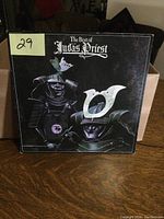 Front cover of 'The Best of Judas Priest' vinyl album showing stylized samurai helmet artwork