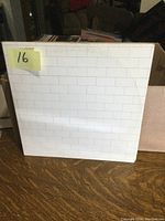 Front cover of Pink Floyd The Wall vinyl LP showing the white brick pattern design
