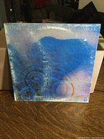 Front cover of Pink Floyd 'Meddle' LP showing the blue and purple ripple design with album title and band name.