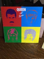 Front of the Queen Hot Space vinyl LP album showing colorful pop-art style band member portraits in four quadrants.