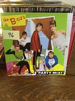 Front cover of The B-52's Party Mix LP showing band members and colorful artwork