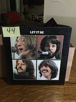 Front cover of Let It Be album showing photos of band members.