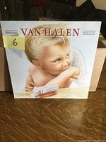 Front cover of Van Halen 1984 vinyl LP showing the iconic angel baby artwork with Roman numerals MCMLXXXIV and album title
