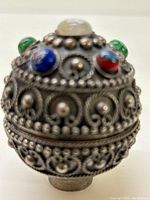 Top and side view of trinket dish showing colored stone embellishments and intricate silver beadwork design