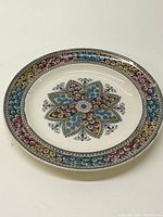 Full view of Copeland and Sons painted ceramic plate with floral design showing rim and center motif
