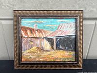 View of the oil painting 'Ryan’s Farm' showing the rustic farm buildings and sky with visible signature at bottom right.