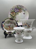 Four-piece lot of vintage and antique china: hand painted pansy plate, Royal Doulton Imari pheasant dish, Wedgwood Wild Strawberry small urn, Aynsley Just Orchids urn