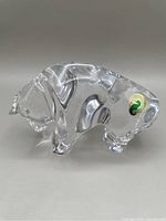 Side view of clear Waterford crystal stylized bull showing the original Waterford sticker and excellent condition.