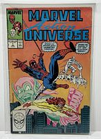 Front cover of Marvel Action Universe issue #1 comic book shows highly detailed, colorful artwork featuring Spider-Man, Firestar, and Iceman against an urban backdrop with a shadowy green figure.