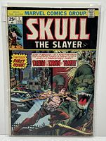 Front cover of Skull The Slayer #1 comic book with first appearance of Skull the Slayer, showing man fighting dinosaur in a city street, published by Marvel Comics Group in August with 25 cents price.