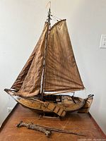 Full view of carved wooden Dutch Botter model with two masts and sails
