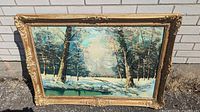 Full view of the winterscape oil painting in frame showing snow-covered trees and landscape.