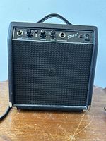 Front view of the Fender SP-10 guitar amplifier showing control panel and woven speaker cloth.