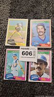 Four individual player cards from the 1981 O-Pee-Chee baseball set: Kent Tekulve (Pirates), Dave Kingman (Cubs), Bill Russell (Dodgers), Dave Lopes (Dodgers) shown on carpeted surface with lot number card