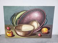 Front view of the large oil on canvas still life painting showing various bowls and fruit.