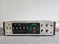 Front panel view showing controls, dial and 8-track slot