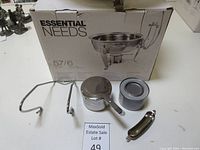 Essential Needs 5.7 liter stainless steel chafing dish box and accessories including stand, fuel can, serving utensil, and fuel holder