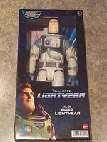 Buzz Lightyear figure in box showing front side with detailed face and chest panel