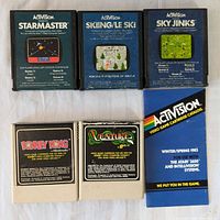 Front view of 5 Atari 2600 video game cartridges including 3 Activision titles and 2 Coleco titles with visible label artwork.