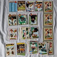 Assorted Topps NFL Football cards from 1979, 1980, 1981 including team leaders, All-Pro cards, and posed action shots of players.