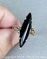 Front view of ring face showing marquise onyx stone