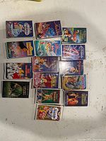 Photo of 15 assorted Disney VHS movies showing titles and front covers
