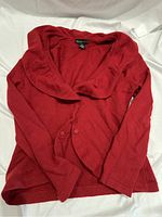 Red Holt Renfrew 100% cashmere sweater front view showing collar and button detail