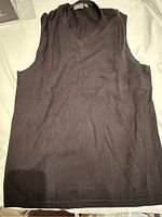 Front view of black sleeveless vest from MEXX showing knit texture and V-neck shape