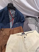 Lot showing all items including denim blazer with handkerchief, grey knit sweater blazer, and two pairs of pants, pale yellow and burnt orange.