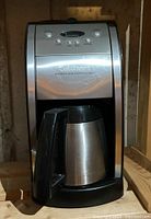 Front view of Cuisinart coffee maker showing the control panel and thermal carafe